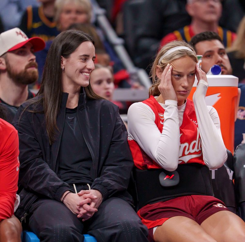 Indiana Fever guard Caitlin Clark (22) and Indiana Fever guard Sophie Cunningham (8) as the Portland Fire face the Indiana Fever Wednesday, May 20, 2026, at the Gainbridge Fieldhouse in Indianapolis. The Indiana Fever defeated the Portland Fire 90-73.