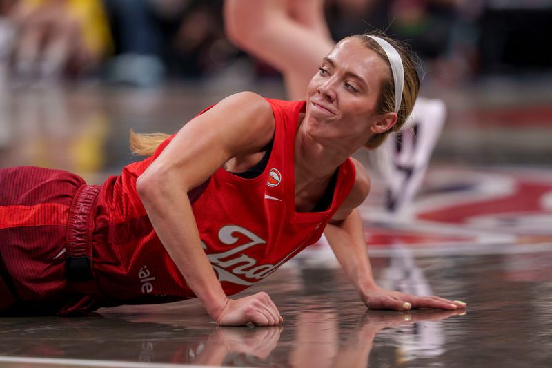 Indiana Fever guard Lexie Hull (10) reacts as the falls to the ground as the Portland Fire face the Indiana Fever Wednesday, May 20, 2026, at the Gainbridge Fieldhouse in Indianapolis. The Indiana Fever defeated the Portland Fire 90-73.