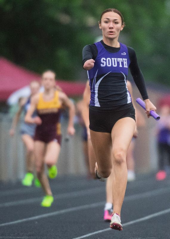 Bloomington South senior Violet Hall was born with her right arm ending below her elbow. She is a top athlete for the Bloomington South girls track team.
