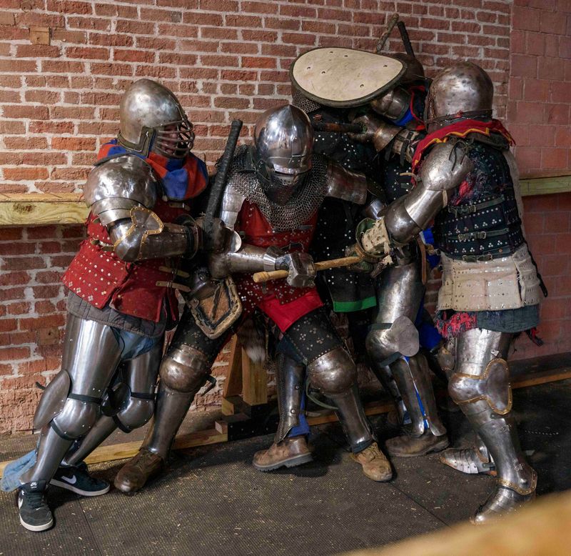 Members of Vernon Vanguard team practice Saturday, March 14, 2026, in Columbus, Indiana. Buhurt refers to full-contact, steel-weapon combat in medieval armor. There are three main disciplines: Duels (1v1), Melees (Team Battles), and Profights/Armored MMA. The ultimate goal in most team categories is to knock the opposing fighters to the ground. Duels and professional fights are scored competitions.