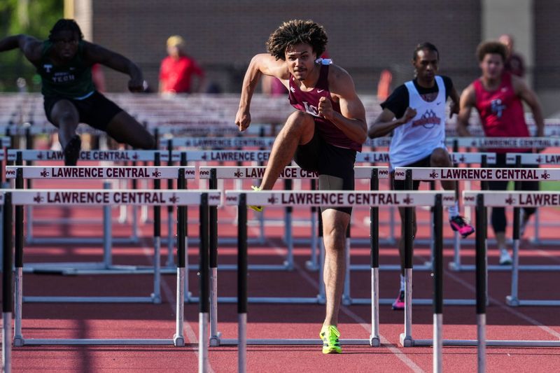 Lawrence Central’s Evan Williams competes in the 110-meter hurdles preliminaries race Thursday, May 21, 2026, during an IHSAA track and field sectionals meet at Lawrence Central High School in Indianapolis.