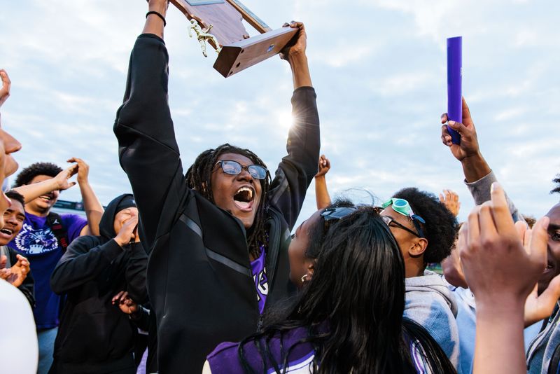 Muncie Central senior Terry Miles holds up the sectional championship trophy after the Bearcats won the IHSAA Boys Track and Field Sectional at Muncie Central High School on Thursday, May 21, 2026.