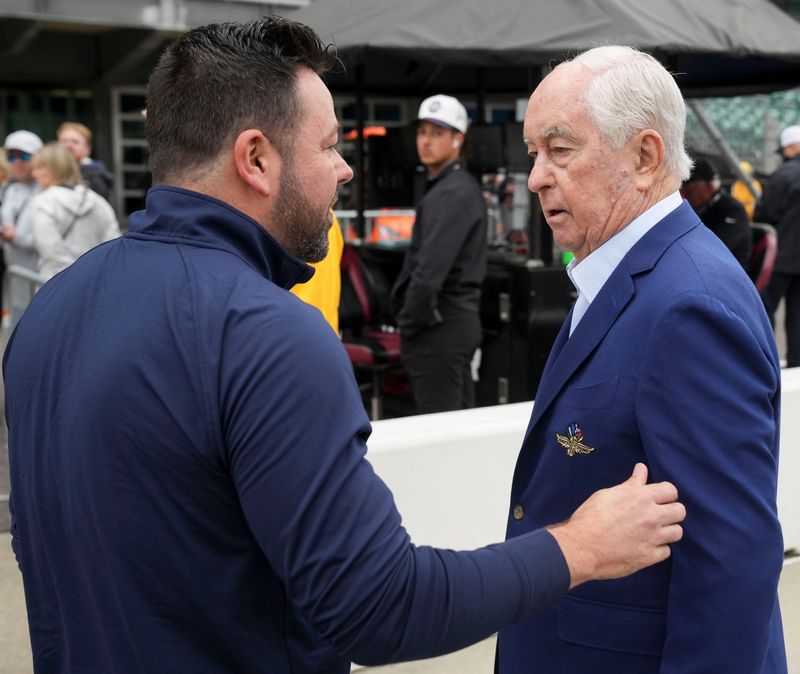 Indiana Lt. Governor Micah Beckwith (left) speaks with Roger Penske, the owner of IndyCar, Indianapolis Motor Speedway and Team Penske, on Friday, May 22, 2026, on Carb Day ahead of the 110th running of the Indianapolis 500 at Indianapolis Motor Speedway.