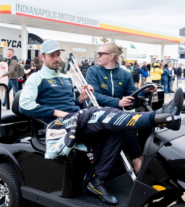 Ed Carpenter Racing driver Alexander Rossi (20) puts his foot up on a golf cart Friday, May 22, 2026, on Carb Day ahead of the 110th running of the Indianapolis 500 at Indianapolis Motor Speedway.