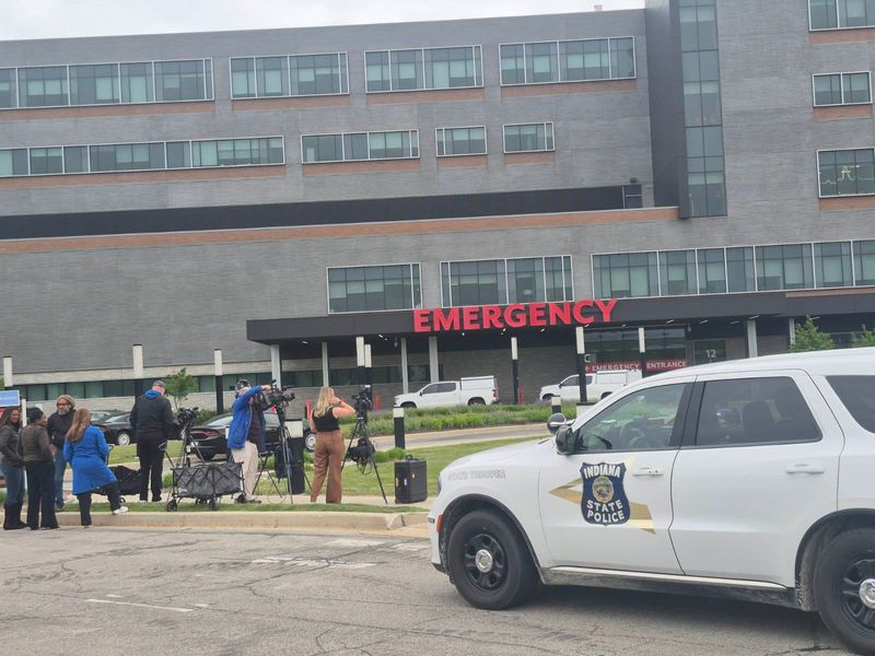 Police and media gather at Franciscan Health hospital in Michigan City on Friday, May 22 after a police officer was shot three times in the emergency room.