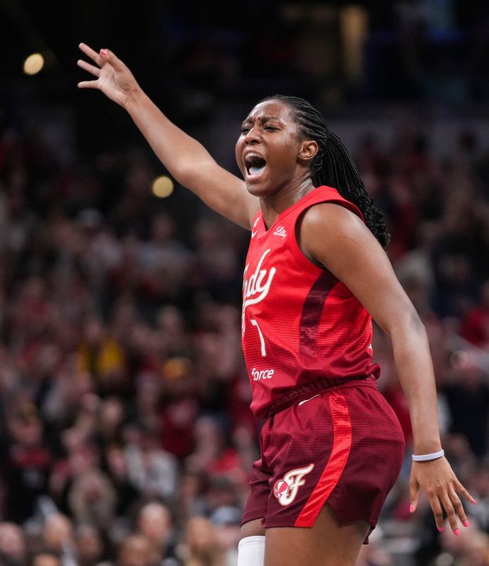 Indiana Fever center Aliyah Boston (7) celebrates a 3-pointer Friday, May 22, 2026, during a game at Gainbridge Fieldhouse in Indianapolis. The Indiana Fever defeated the Golden State Valkyries, 90-82.