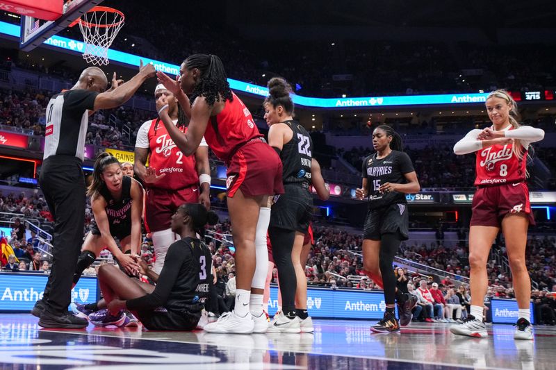 Golden State Valkyries forward Laeticia Amihere (3) and Indiana Fever center Aliyah Boston (7) react to the action Friday, May 22, 2026, during a game at Gainbridge Fieldhouse in Indianapolis. The Indiana Fever defeated the Golden State Valkyries, 90-82.
