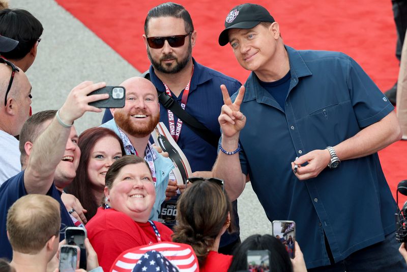 Brendan Fraser poses for photos with fans Sunday, May 24, 2026, ahead of the 110th running of the Indianapolis 500 at Indianapolis Motor Speedway.