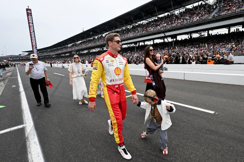 Team Penske driver Josef Newgarden (2) walks pit lane Sunday, May 24, 2026, ahead of the 110th running of the Indianapolis 500 at Indianapolis Motor Speedway.