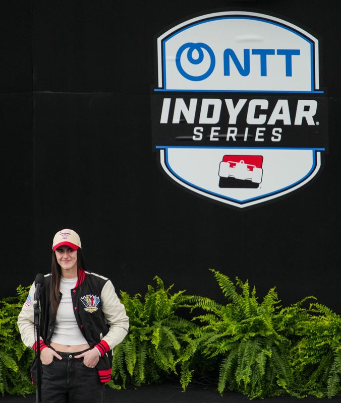 Indiana Fever guard and grand marshal Caitlin Clark stands on stage Sunday, May 24, 2026, ahead of the 110th running of the Indianapolis 500 at Indianapolis Motor Speedway.
