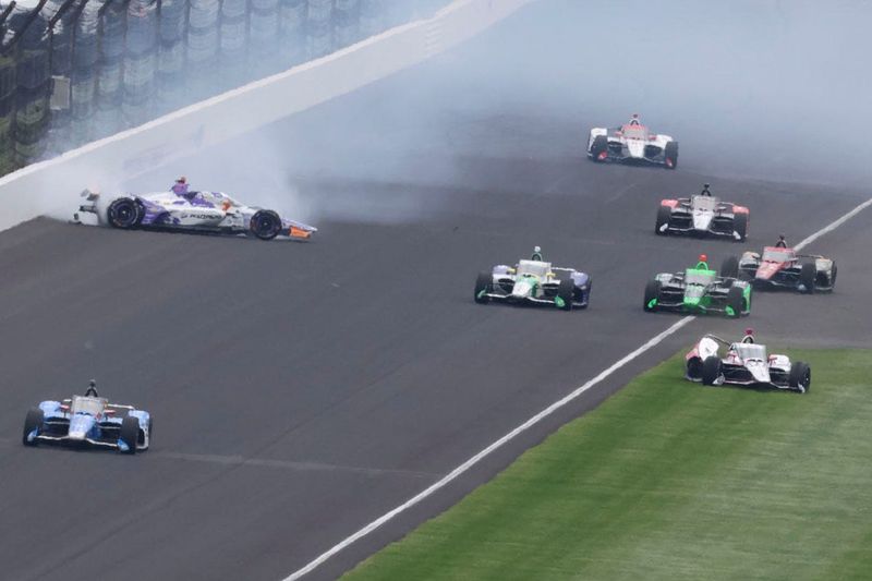 Arrow McLaren driver Ryan Hunter-Reay (31) and HMD Motorsports with AJ Foyt Racing driver Katherine Legge (11) crash on the exit of the second turn Sunday, May 24, 2026, during the 110th running of the Indianapolis 500 at Indianapolis Motor Speedway.