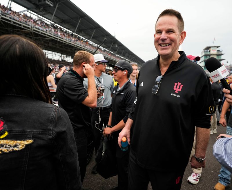 Indiana University's Curt Cignetti walks through pit lane Sunday, May 24, 2026, ahead of the 110th running of the Indianapolis 500 at Indianapolis Motor Speedway.