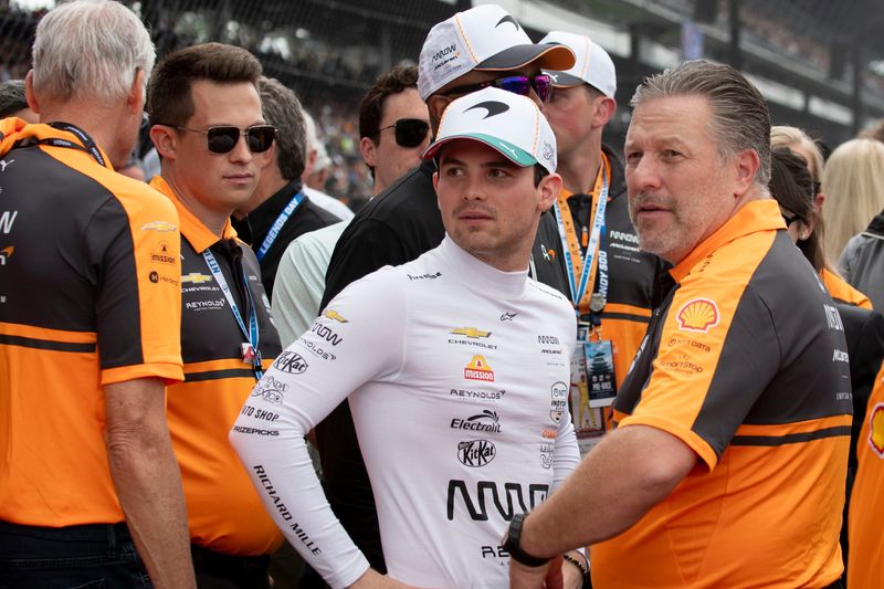 Arrow McLaren driver Pato O'Ward (5) talks with Zak Brown on Sunday, May 24, 2026, ahead of the 110th running of the Indianapolis 500 at Indianapolis Motor Speedway.