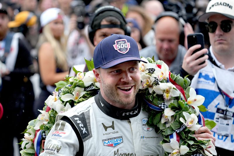 Felix Rosenqvist leaves the track after kissing the bricks people Sunday, May 24, 2026, after the 110th running of the Indianapolis 500 at Indianapolis Motor Speedway.