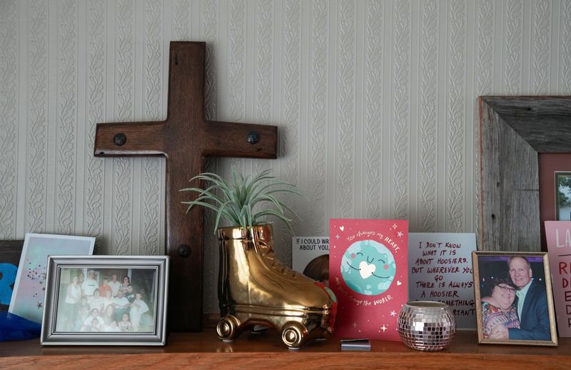 Figures, decorations and cards sit on a mantel at Suzanne Swierc's home on Tuesday, May 19, 2026, in Muncie.