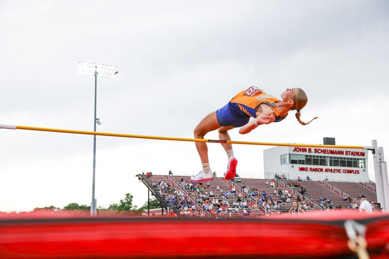 North White high jumper Olivia Dahlenburg leaps to clear the bar at the IHSAA girls track & field regional at Jeff High School on May 26, 2026.