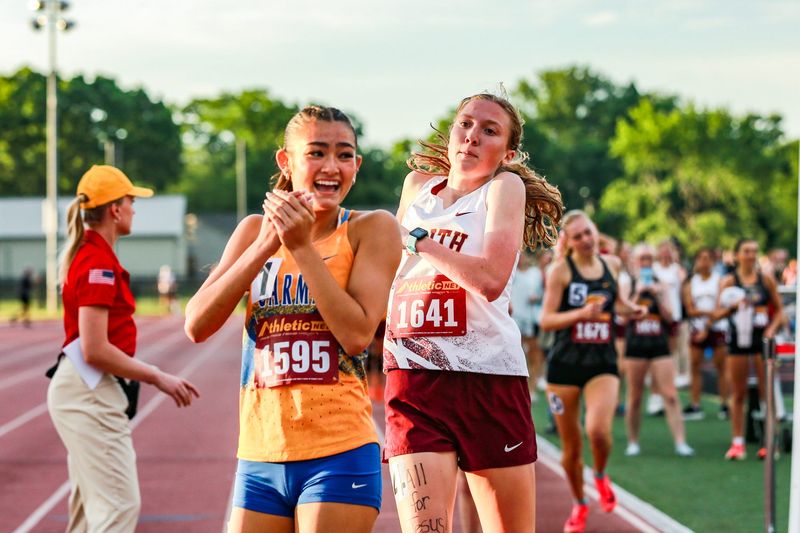 Faith Christian distance runner Ashley Caplinger finishes hot on the heels of Carmel's Kaitlyn Oshimura to secure a third place finish and a surprise state meet berth in the 800-meter run at the IHSAA girls track & field regional at Jeff High School on May 26, 2026.