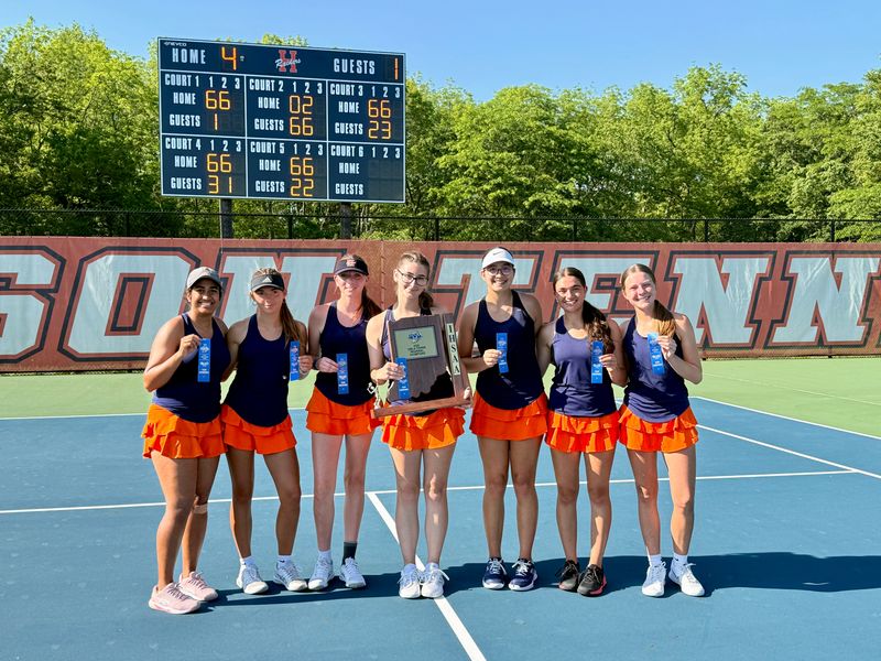 Harrison's varsity tennis team poses with the regional championship trophy after the Raiders defeated Eastern 4-1 on May 27, 2026 in West Lafayette.