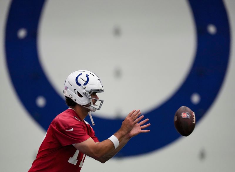 Indianapolis Colts quarterback Daniel Jones (17) catches the snap Wednesday, May 27, 2026, during practice at the Indiana Farm Bureau Football Center in Indianapolis.