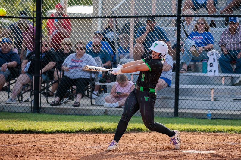 Yorktown junior Olivia Jaromin (11) hits a home run at the IHSAA Softball 3A Sectional Semi-Final at Connersville High School.