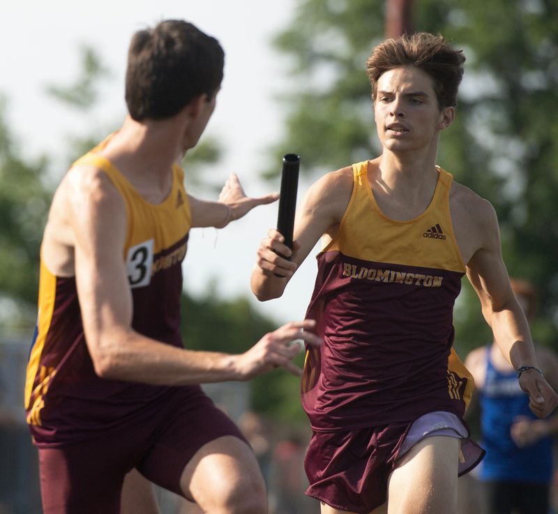 North's Shep Jackson prepares to hand off to Caelan D'Onofrio as he runs his leg during the 4 x 800 meter relay race during the IHSAA boys regional track meet at Bloomington High School South on Thursday, May 28, 2026.