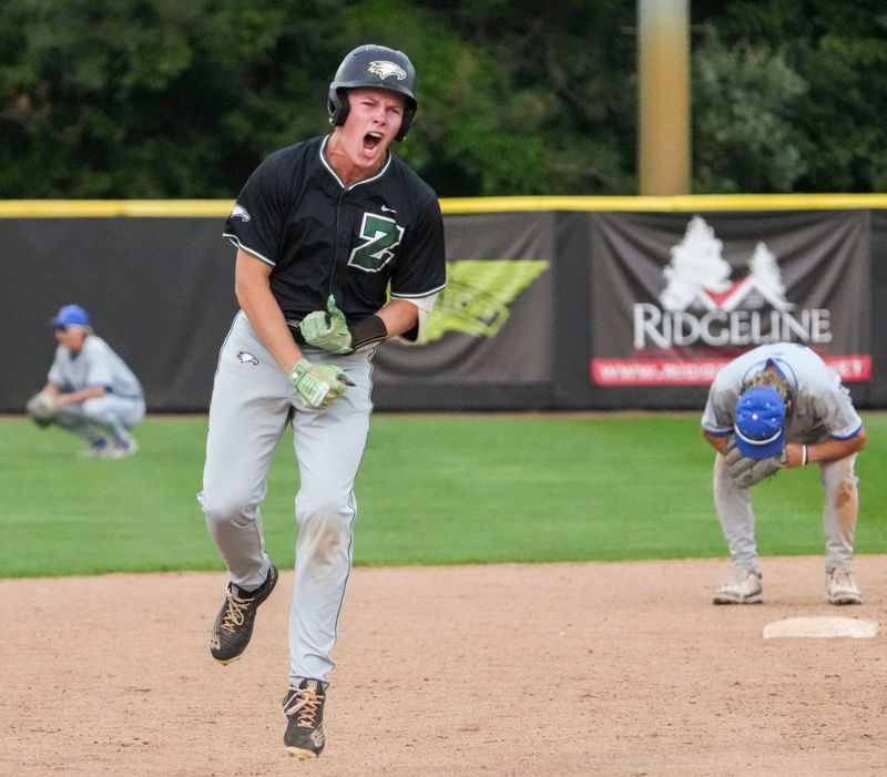 Zionsville Eagles outfielder Reid Zittel (5) celebrates a walk-off home run Friday, May 29, 2026, during a sectional semifinal matchup at Dunker Field at Hazel Dell Elementary School in Noblesville. The Zionsville Eagles defeated the Hamilton Southeastern Royals, 7-6.