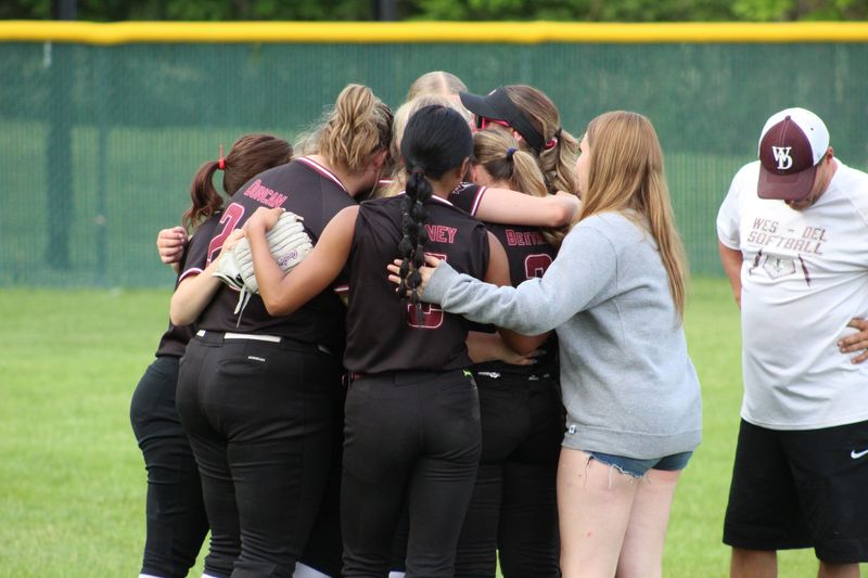 The Wes-Del softball team embraces after falling to Southwood in the IHSAA Class 1A Sectional 55 championship at Wes-Del Junior/Senior High School on Friday, May 29, 2026.