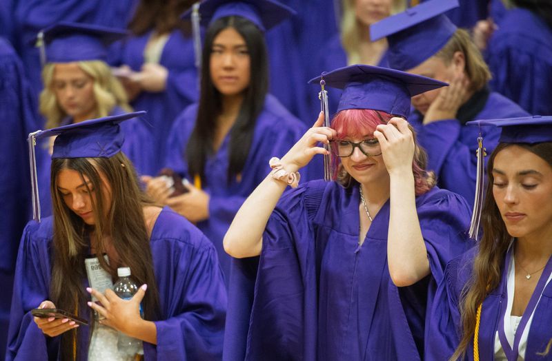 Orion Barbosa gets ready before the start of graduation at Bloomington High School South on Saturday, May 30, 2026.