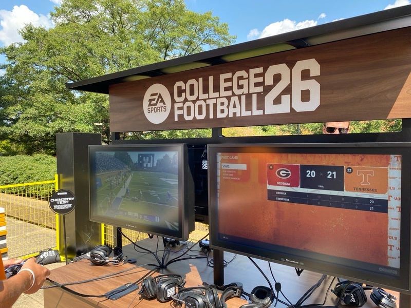 One of the stations where students and fans can play EA Sports College Football 26. The game is ready for players to pick up the controllers and start playing.