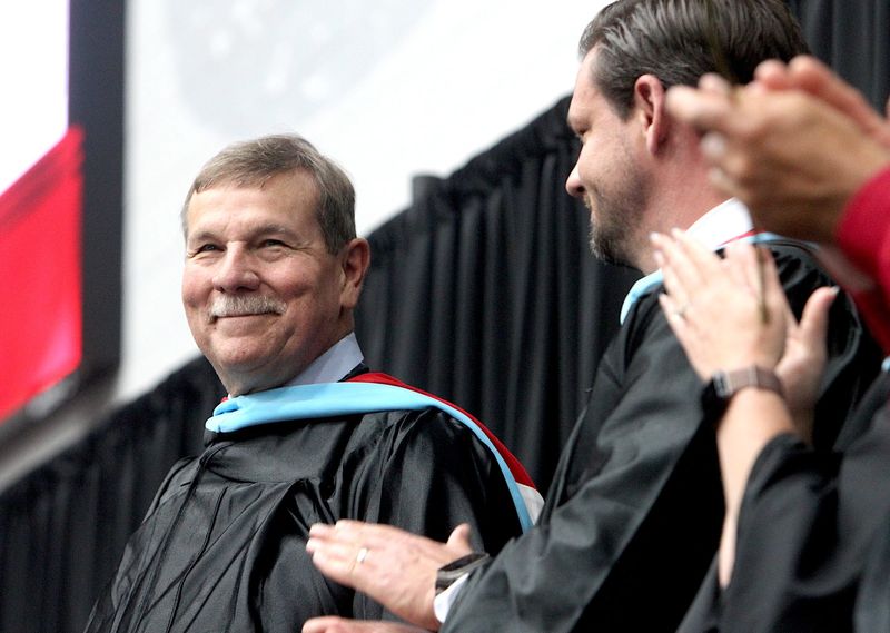 Edgewood High School Principal Dirk Ackerman smiles as he receives a standing ovation following his speech to the Class of 2026. Ackerman was commencement speaker for his final graduation. Ackerman is retiring after serving Edgewood High School as principal for 20 years.
