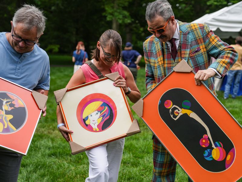 Nicholas D. Lowry appraises posters with fans on Monday, June 1, 2026, during Antiques Roadshow at Newfields in Indianapolis.