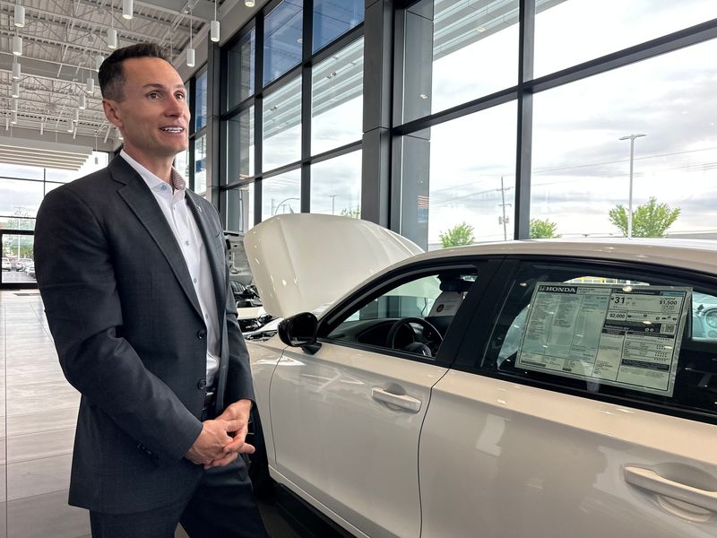 Rohrman Automotive Group CEO Ryan Rohrman discusses car prices in the newly renovated Honda dealership at 821 Sagamore Parkway S.