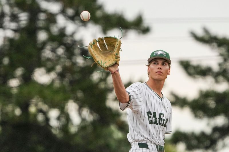 Zionsville Eagles pitches Davis Moore (11) prepares to pitch Monday, June 1, 2026, during a sectional championship matchup at Dunker Field at Hazel Dell Elementary School in Noblesville. The Zionsville Eagles defeated the Fishers Tigers, 4-3.