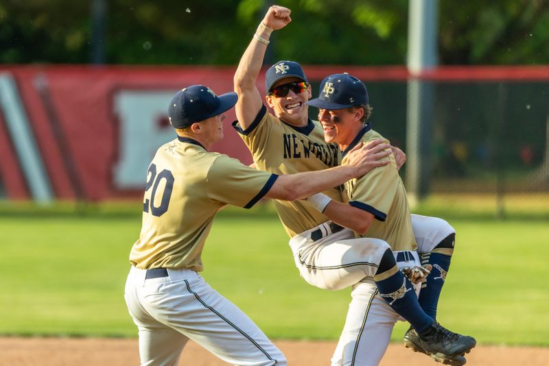New Prairie's Colton Griffiths (20), from left, celebrates with Giovanni Naccarato (4) and Connor Tidwell (5) after winning the New Prairie vs. Culver Academies sectional championship baseball game, Monday, June 1, 2026 at Centennial Park in Plymouth.
