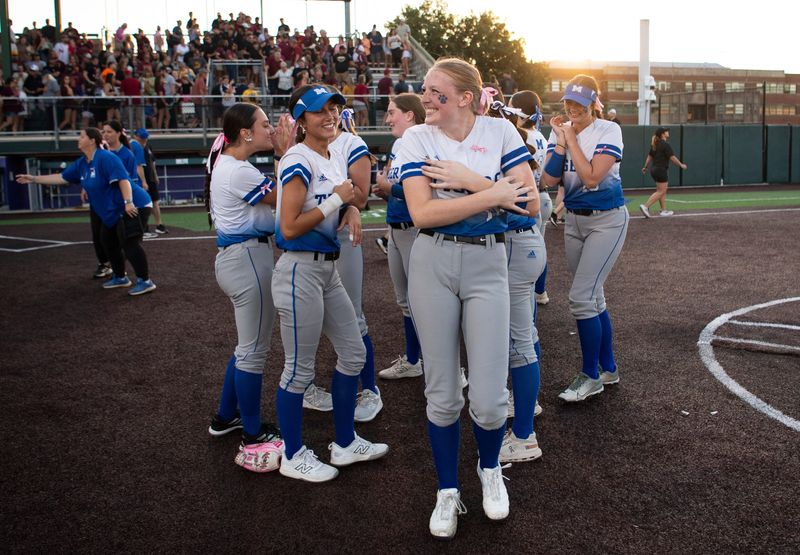 The Memorial Lady Tigers celebrate their 2026 IHSAA Class 3A Softball Regional victory over the Gibson Southern Lady Titans at Cooper Stadium in Evansville, Ind., Tuesday, June 2, 2026.