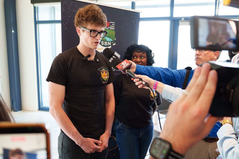 Christian Loomis, a graduate of Amazon's Work-Based Learning Program, speaks to the media at the Campus Administration Building of Amazon's Project Rainier data center Wednesday, June 3, 2026, between New Carlisle and South Bend.