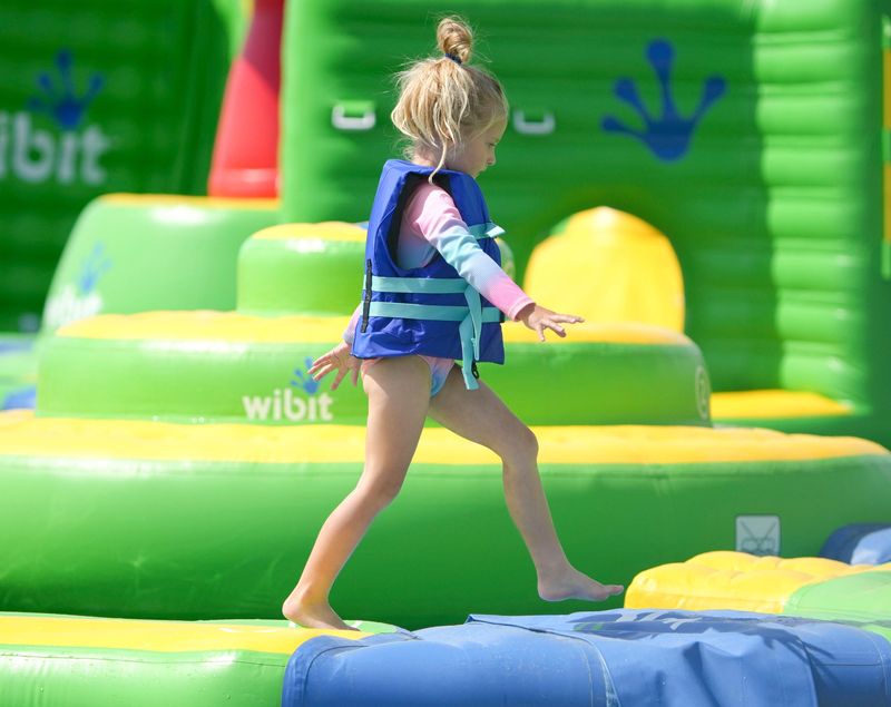 Clare Reichel, 5, walks the floating obstacle course Thursday, June 4, 2026, at SKYLAKE Adventures in Sheridan, Ind.