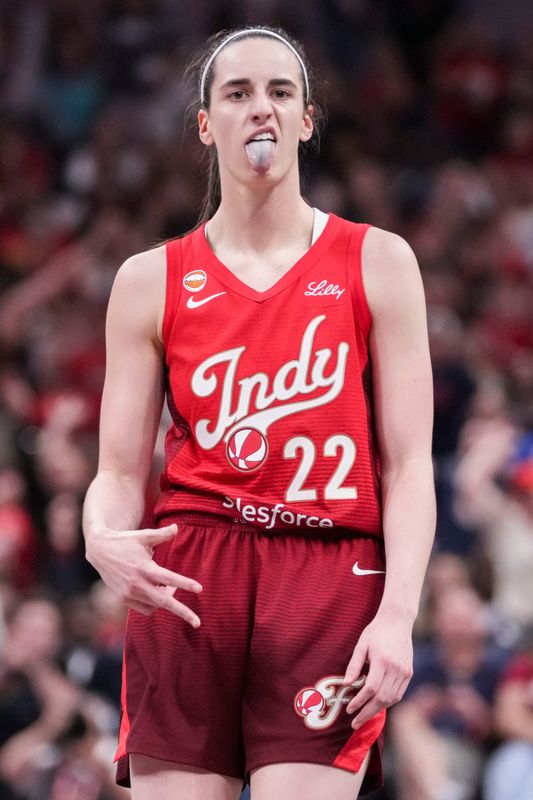 Indiana Fever guard Caitlin Clark (22) celebrates a 3-pointer Thursday, June 4, 2026, during the second half of a game at Gainbridge Fieldhouse in Indianapolis. The Indiana Fever defeated the Atlanta Dream, 83-71.