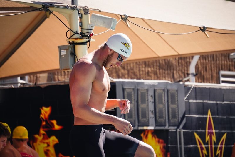 Grant House gets ready to compete during a meet at the Mona Plummer Aquatic Complex at ASU. He started in Tempe as a student-athlete. These days, he trains and competes in the same pool, but as a professional swimmer. His goal is to become an Olympian.
