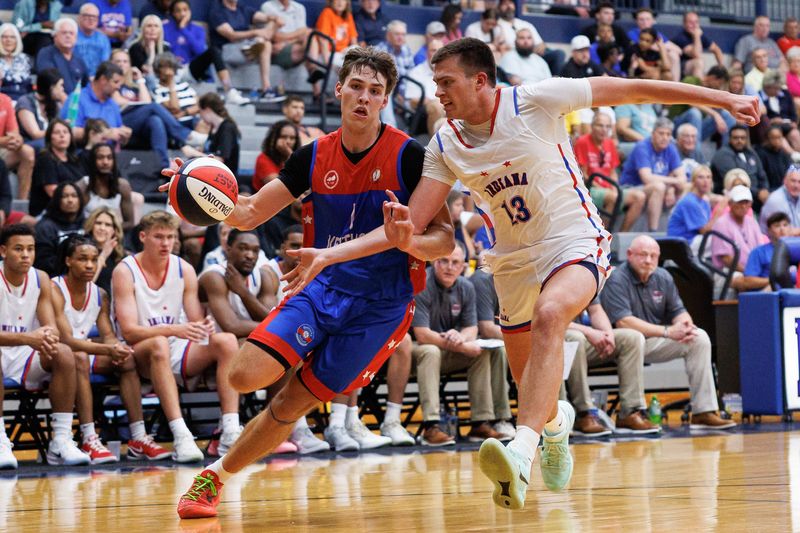 Kentucky's Jake Feldhaus (1) drives to the basket against Indiana's Brady Scholl (13) during the Kentucky/Indiana All-Star Game at Lexington Catholic High School on Friday, June 5, 2026.