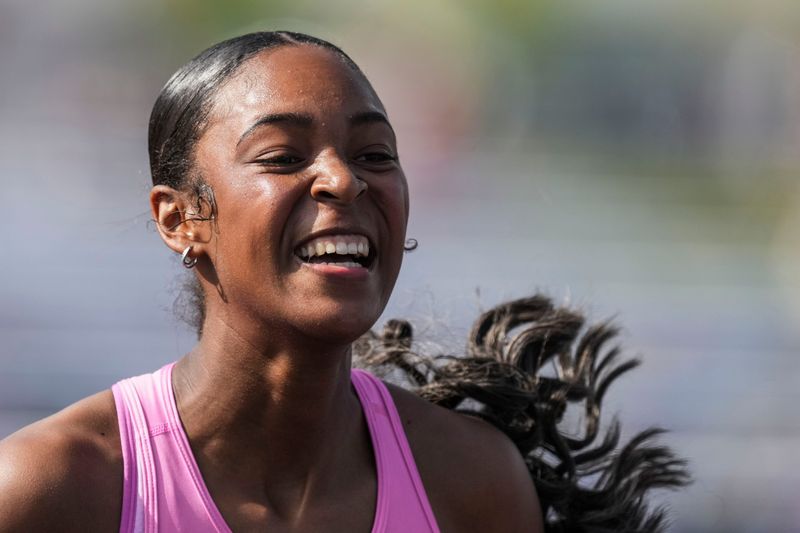 South Bend Washington’s Adriana Swanson smiles after competing in the 100 meter hurdles preliminary race Friday, June 5, 2026, during the IHSAA girls track and field state finals at North Central High School in Indianapolis.