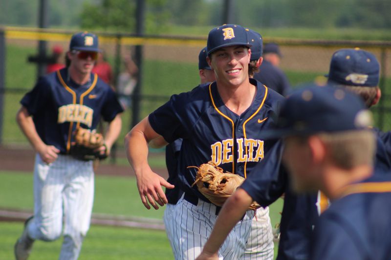 Delta senior Everrett Linn is all smiles as he returns to the dugout during the Eagles' loss to Norwell in an IHSAA Class 3A regional championship at Oak Hill High School on Saturday, June 6, 2026.