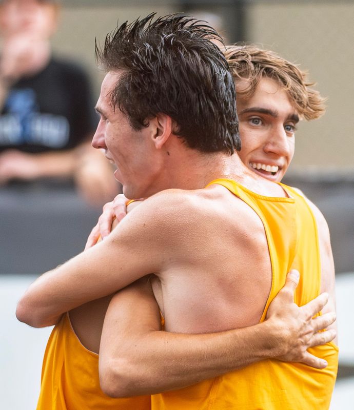 North's Caleb Winders hugs Caelan D'Onofrio after they won the 4 x 800 meter relay race during the IHSAA boys state track meet at North Central High School on Saturday, June 6, 2026.