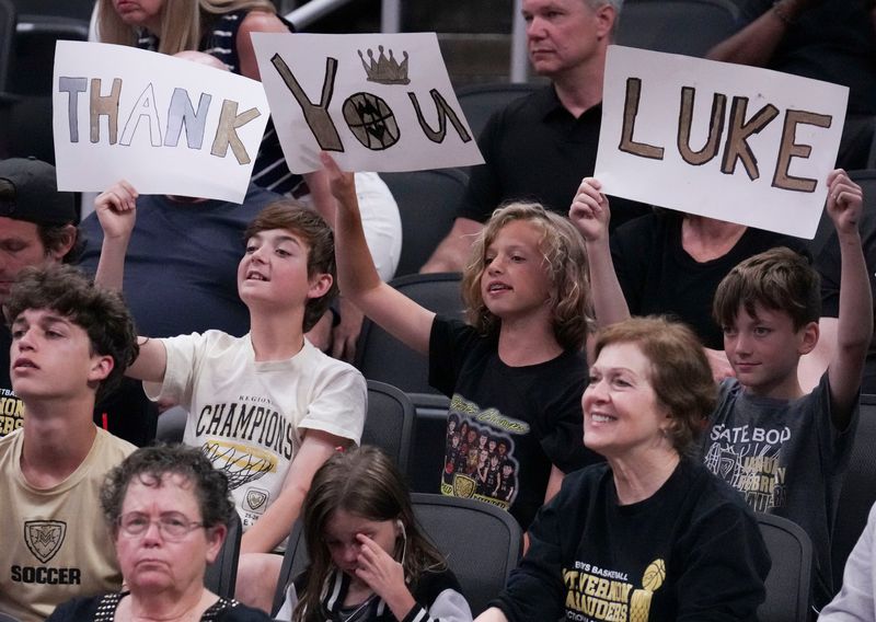 Fans hold up signs Saturday, June 6, 2026, during a game between the Indiana All-Stars and Kentucky All-Stars at Gainbridge Fieldhouse in Indianapolis.
