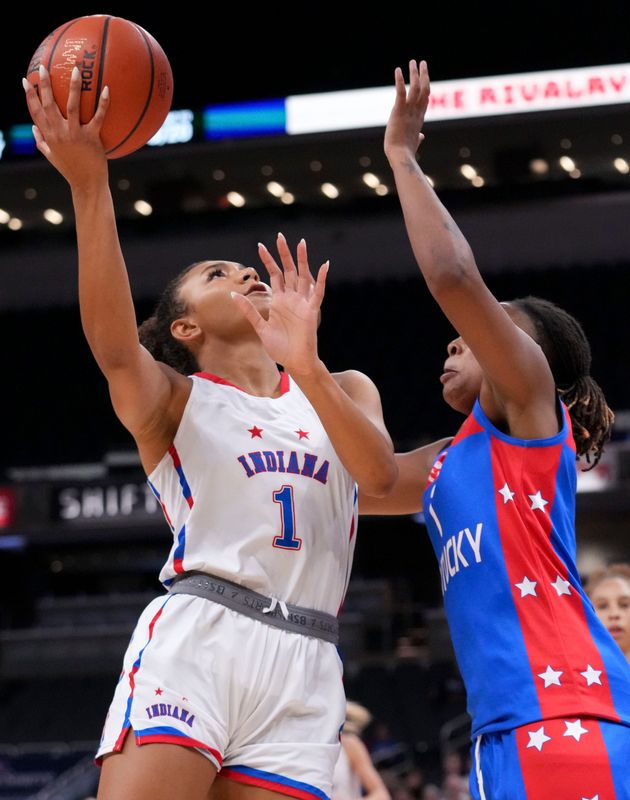 Indiana All-Stars' Gracyn Gilliard (1) shoots the ball over Kentucky All-Stars' Ashlinn James (1) on Saturday, June 6, 2026, during a game between the girl’s Indiana All-Stars and Kentucky All-Stars at Gainbridge Fieldhouse in Indianapolis. Indiana defeated Kentucky 90-71.