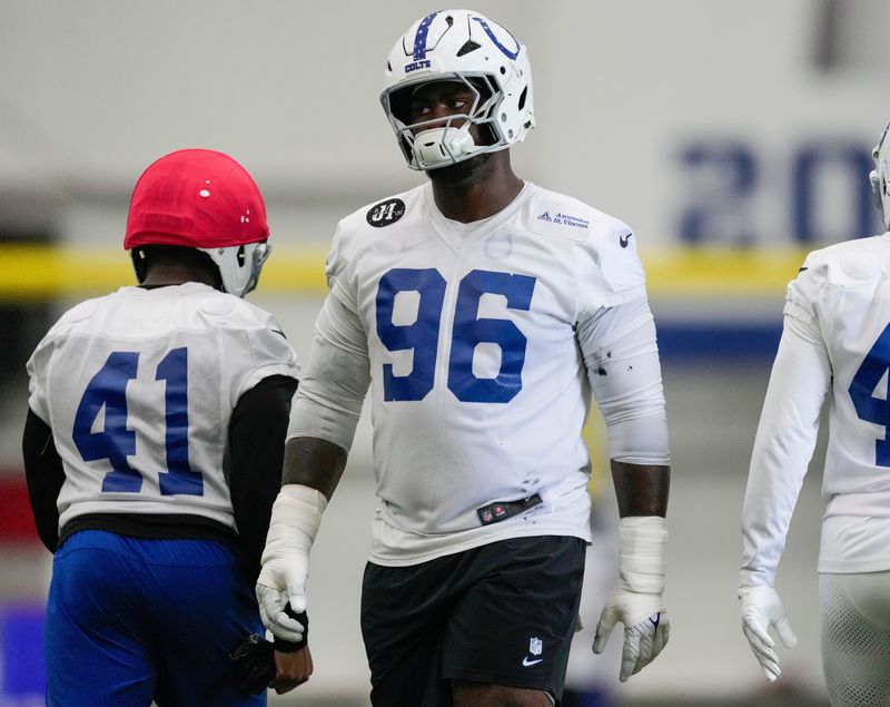Indianapolis Colts defensive tackle Colby Wooden (96) warms up on the field Wednesday, May 27, 2026, during practice at the Indiana Farm Bureau Football Center in Indianapolis.