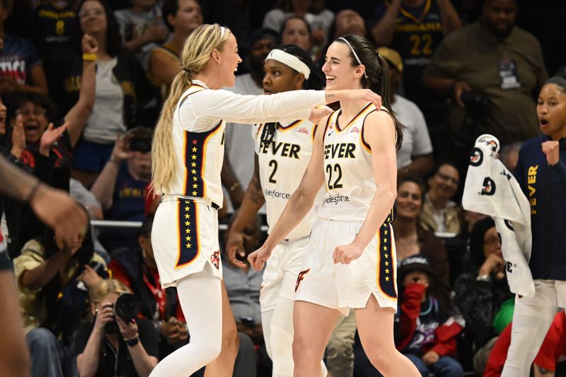 Jun 8, 2026; Washington, District of Columbia, USA; Indiana Fever guard Caitlin Clark (22) celebrates with guard Lexie Hull (10) after defeating the Washington Mystics at CareFirst Arena.