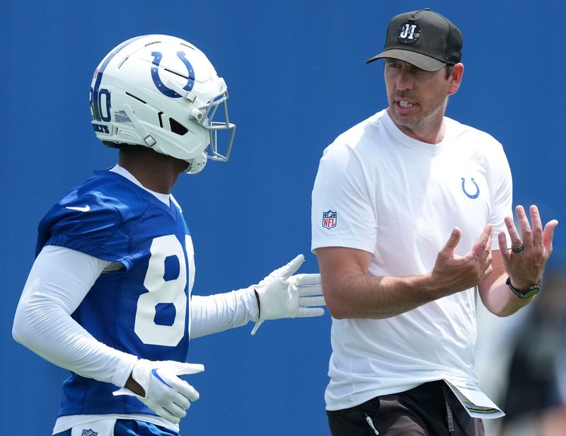 Indianapolis Colts head coach Shane Steichen speaks withwide receiver Deion Burks (80) during the team’s veteran minicamp Tuesday, June 9, 2026, at the Indiana Farm Bureau Football Center in Indianapolis.