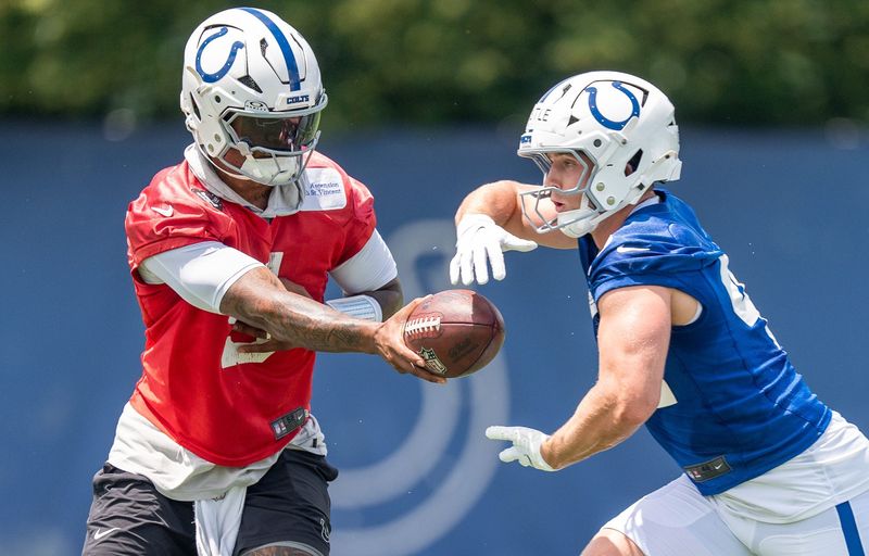 Indianapolis Colts quarterback Anthony Richardson Sr. (5) hands off to running back Anderson Castle (42) on Wednesday, June 10, 2026, during minicamp at Indiana Farm Bureau Football Center in Indianapolis.
