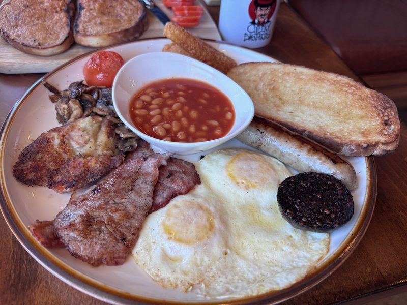 A full English breakfast with eggs, Cumberland sausage, back bacon, baked beans, grilled tomatoes and mushrooms, sourdough toast, black pudding and bubble and squeak is among the English fare at Cheeky Bastards, 11210 Fall Creek Road, Fishers. June 12, 2026